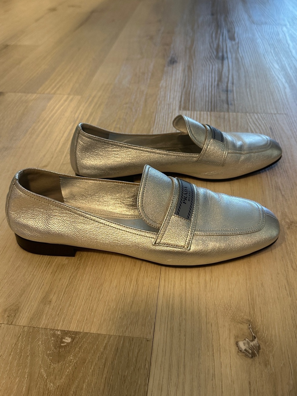 Prada Metallic Silver Leather Penny Loafers - Woman’s